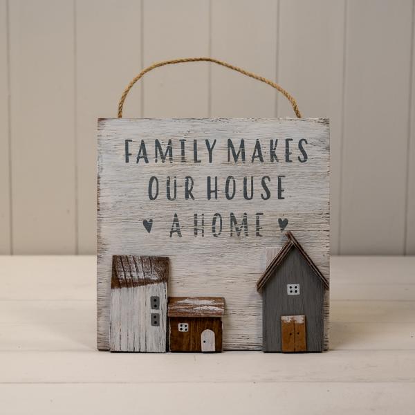 White Wooden Home Sign 'Family Makes Our House A Home' With Grey White and Brown Stand Out Houses