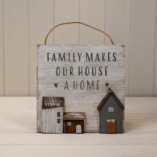White Wooden Home Sign 'Family Makes Our House A Home' With Grey White and Brown Stand Out Houses