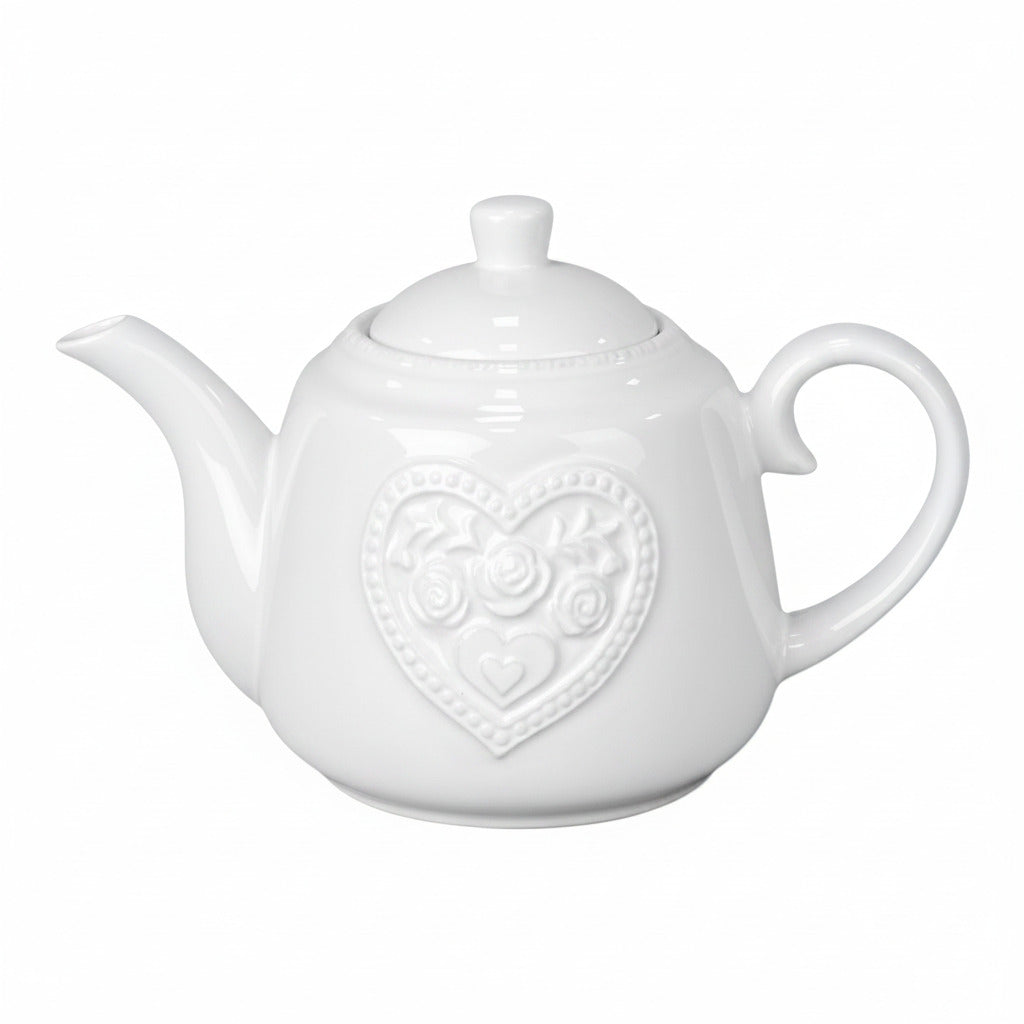 Pink teapot with heart design on a white background