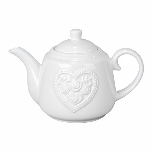 Pink teapot with heart design on a white background
