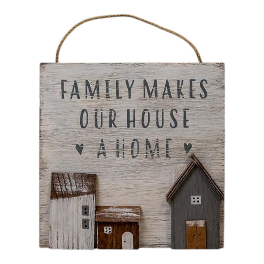 White Wooden Home Sign 'Family Makes Our House A Home' With Grey  White and Brown Stand Out Houses